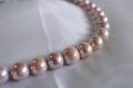N-001 | Rare Coral Glow Pearl Necklace with Infinity Clasp (13.8mm)